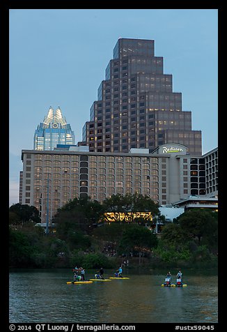 Water bicycles on Austin Lake at dusk. Austin, Texas, USA (color)