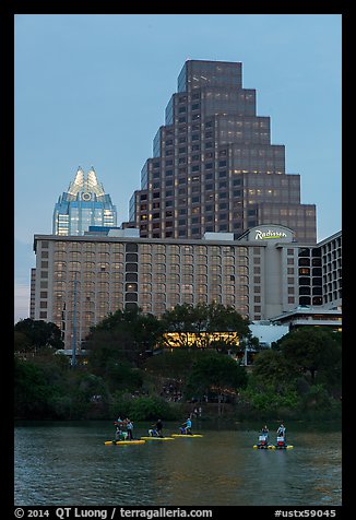 Water bicycles on Colorado River at dusk. Austin, Texas, USA (color)