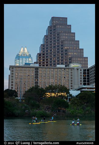 Water bicycles on Colorado River at dusk. Austin, Texas, USA (color)