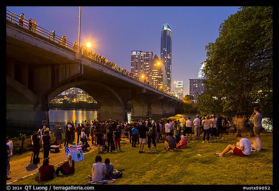 People gathered for dusk bat flight at Congress Bridge. Austin, Texas, USA (color)
