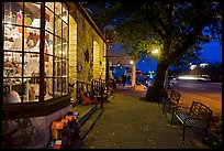 Sidewalk and stores at dusk. Fredericksburg, Texas, USA ( color)