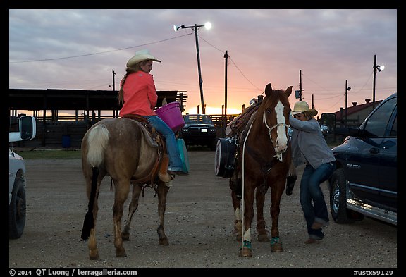 Women preparing to ride horses. Fort Worth, Texas, USA (color)