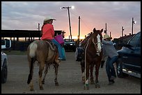 Women preparing to ride horses. Fort Worth, Texas, USA ( color)