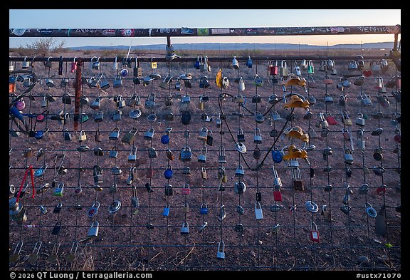 Locks fastened to a roadside fence at Prada Marfa, Valentine. Texas, USA (color)