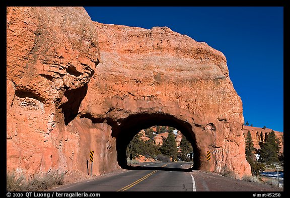 Road tunnel in pink limestone cliff. Utah, USA