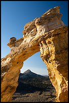 Grosvenor Arch framing peak. Grand Staircase Escalante National Monument, Utah, USA ( color)