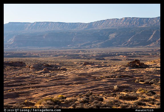 Slickrock with arches and Straight Cliffs, Fortymile Ridge. Grand Staircase Escalante National Monument, Utah, USA (color)