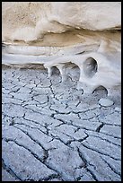 Cracked mud and cliff with holes. Grand Staircase Escalante National Monument, Utah, USA ( color)