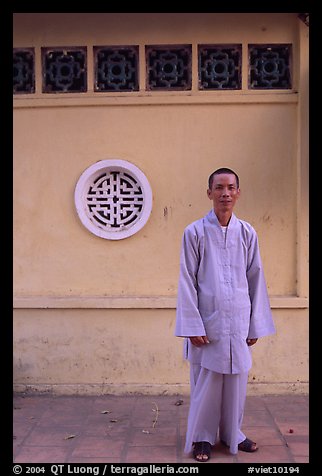 Monk standing outside Giac Vien Pagoda, district 11. Ho Chi Minh City, Vietnam (color)