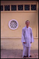 Monk standing outside Giac Vien Pagoda. Ho Chi Minh City, Vietnam ( color)