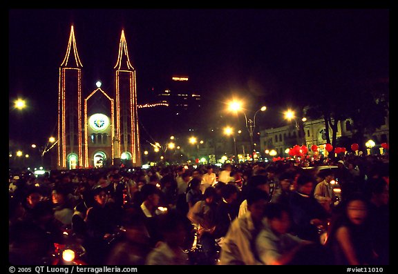 Crowds gather in front of the Cathedral St Joseph for Christmans. Ho Chi Minh City, Vietnam (color)