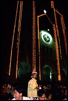 Child with christmas hat in front of St Joseph Cathedral on Christmas eve. Ho Chi Minh City, Vietnam ( color)