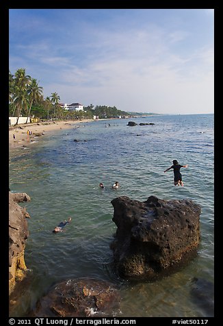 Child jumping in water, Duong Dong. Phu Quoc Island, Vietnam (color)