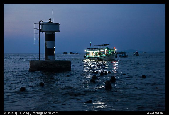 Lighted boat a dusk. Phu Quoc Island, Vietnam (color)