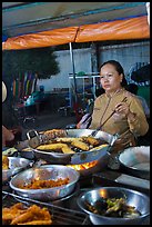 Woman preparing food, Dinh Cau Night Market. Phu Quoc Island, Vietnam ( color)