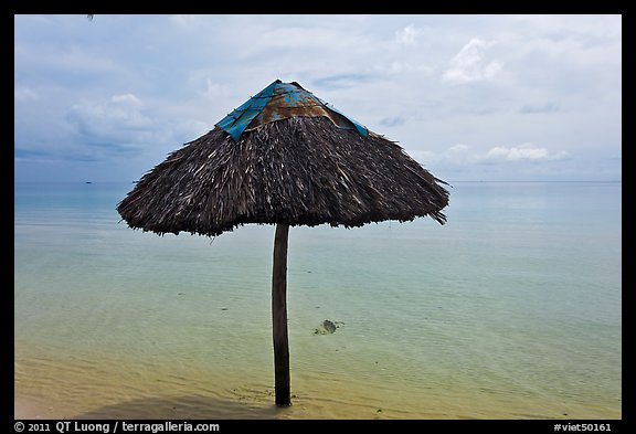 Sun shade in shallow beach water. Phu Quoc Island, Vietnam