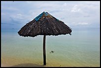 Sun shade in shallow beach water. Phu Quoc Island, Vietnam