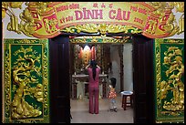 Woman with girl worshipping at Dinh Cau temple, Duong Dong. Phu Quoc Island, Vietnam