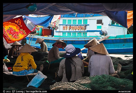 Women repairing fish nets, Duong Dong. Phu Quoc Island, Vietnam (color)