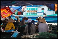 Women repairing fish nets, Duong Dong. Phu Quoc Island, Vietnam ( color)