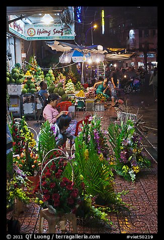 Flower and vegetable stores at night. Ho Chi Minh City, Vietnam (color)