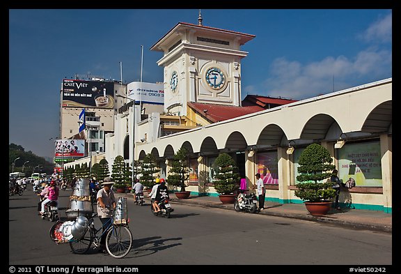 Food vendor riding outside Ben Thanh Market. Ho Chi Minh City, Vietnam (color)