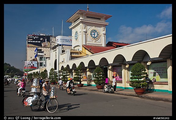 Food vendor riding outside Ben Thanh Market. Ho Chi Minh City, Vietnam (color)