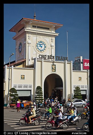 Motorbike traffic and Ben Thanh Market. Ho Chi Minh City, Vietnam (color)