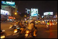 Moving traffic at night on traffic circle. Ho Chi Minh City, Vietnam