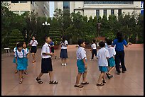 Children walking in circle in park. Ho Chi Minh City, Vietnam