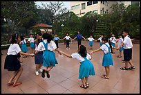 Children playing in circle in park. Ho Chi Minh City, Vietnam ( color)