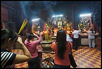 Worshipping at altar with  Jade Emperor and Four Big Diamonds, Chua Ngoc Hoang, district 3. Ho Chi Minh City, Vietnam