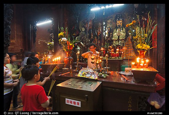 Man lightening candles, Jade Emperor Pagoda, district 3. Ho Chi Minh City, Vietnam