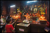 Man lightening candles, Jade Emperor Pagoda, district 3. Ho Chi Minh City, Vietnam
