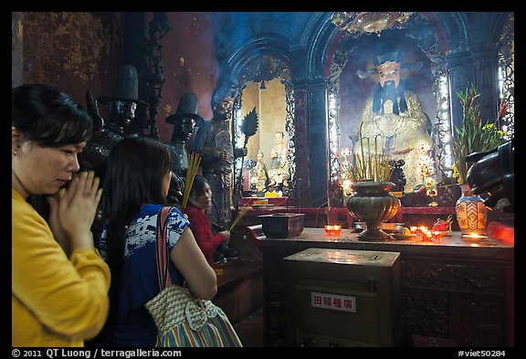 Women worshipping Thang Hoang, Phuoc Hai Tu pagoda, district 3. Ho Chi Minh City, Vietnam (color)