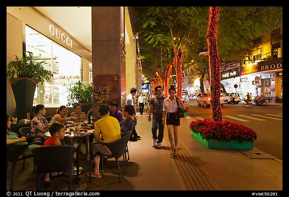 Street with luxury stores at night. Ho Chi Minh City, Vietnam (color)