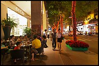 Street with luxury stores at night. Ho Chi Minh City, Vietnam (color)