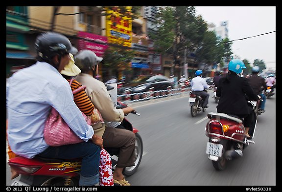 Motorcycle traffic seen from a motorcyle in motion. Ho Chi Minh City, Vietnam (color)