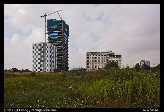 High rise towers in construction on former swampland, Phu My Hung, district 7. Ho Chi Minh City, Vietnam