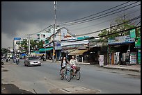 Street with moonson clouds, district 7. Ho Chi Minh City, Vietnam (color)