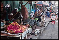 Vendors sleeping on the street at dawn. Ho Chi Minh City, Vietnam ( color)