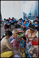 Food vendor preparing breakfast on the street. Ho Chi Minh City, Vietnam ( color)