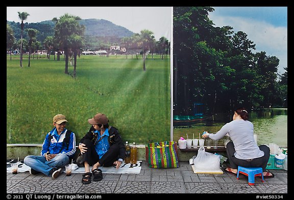 Students, food vendor, and landscape backdrops. Ho Chi Minh City, Vietnam