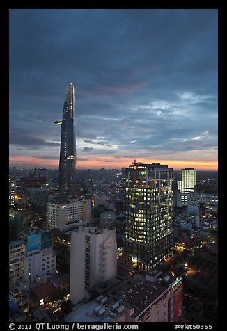 Bitexco Tower and city lights at sunset. Ho Chi Minh City, Vietnam (color)