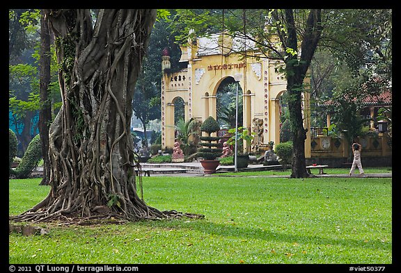 Tree, lawn, and gate, Van Hoa Park. Ho Chi Minh City, Vietnam (color)