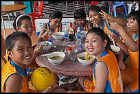 Girls sports team eating, Van Hoa Park. Ho Chi Minh City, Vietnam ( color)