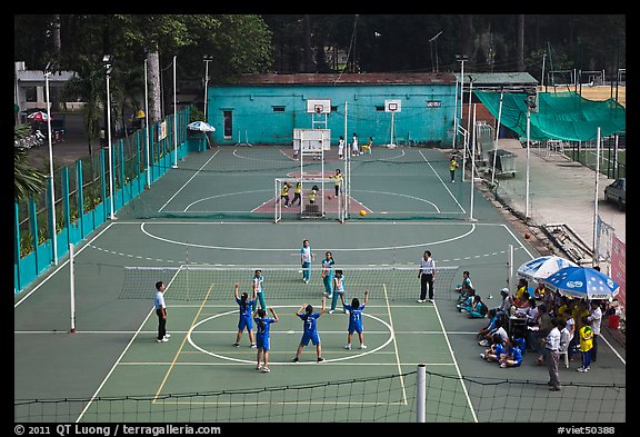 Girls Volleyball players and coaches, Cong Vien Van Hoa Park. Ho Chi Minh City, Vietnam (color)