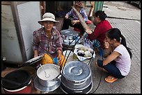 Woman offering soft tofu on the street. Ho Chi Minh City, Vietnam