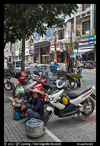 Tofu vendor and sugar cane vendor on the street. Ho Chi Minh City, Vietnam (color)