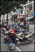 Tofu vendor and sugar cane vendor on the street. Ho Chi Minh City, Vietnam (color)